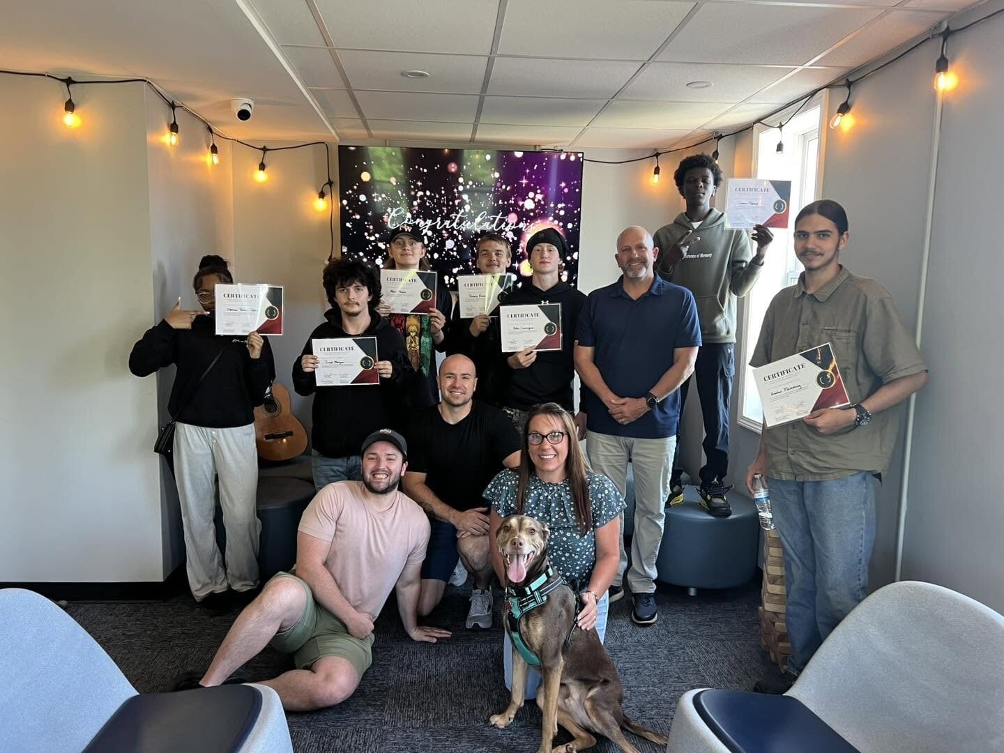 Rise Above students and staff celebrating with their certificates